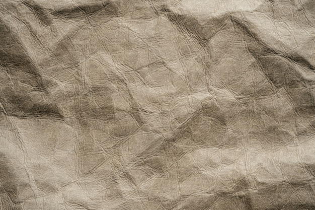 Texture of craft crumpled natural washing beige.