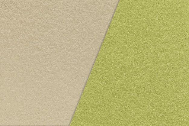 Texture of craft light beige and green paper background half two colors Vintage kraft olive cardboard