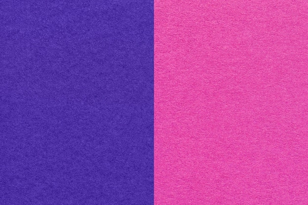 Texture of craft navy blue and purple paper background half two colors macro Vintage dense magenta cardboard