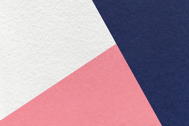 Texture of craft navy blue white and pink shade color paper background macro Vintage abstract indigo cardboard