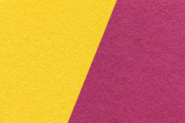 Texture of craft purple and yellow paper background half two colors macro Vintage kraft wine and golden cardboard