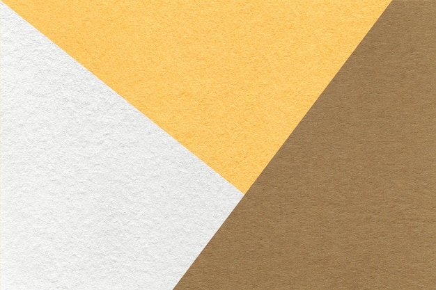 Texture of craft white yellow and brown shade color paper background macro Vintage abstract beige cardboard