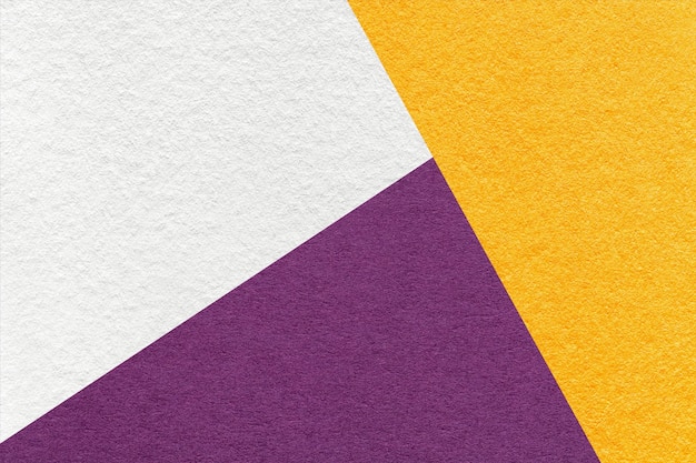 Texture of craft white yellow and dark violet shade color paper background macro Structure of abstract cardboard