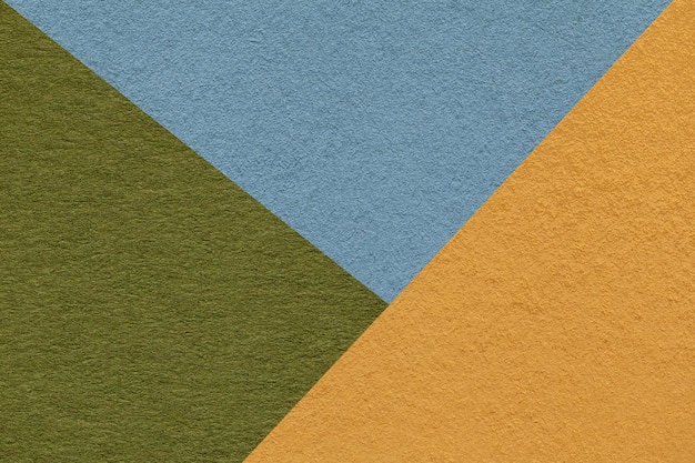 Texture of craft yellow green and blue shade color paper background macro Vintage abstract cardboard