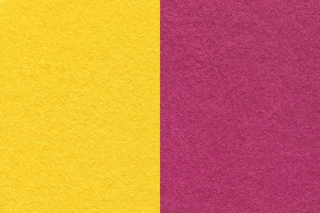 Texture of craft yellow and purple paper background half two colors macro Vintage golden and wine cardboard