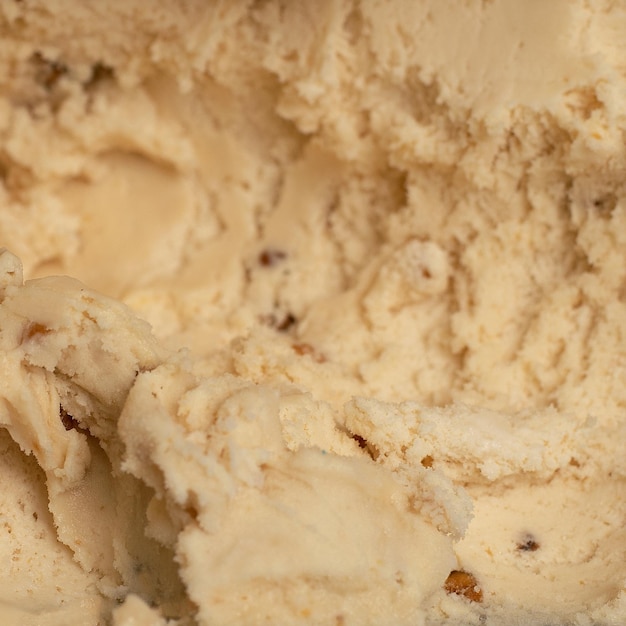 Texture of creamy vanilla ice cream with nuts