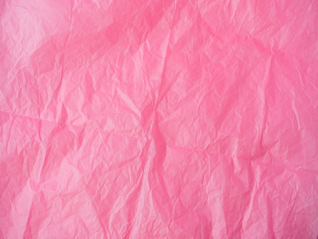 The texture of crumpled paper is maroon. top view, copy space. color background