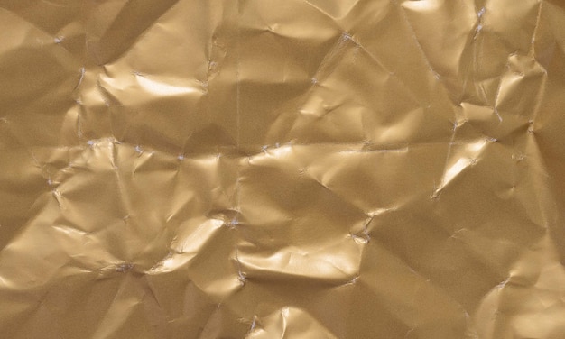 Texture of a crumpled sheet of yellow paper