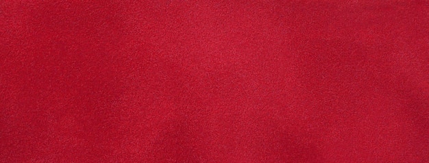 Texture of dark red velvet matte background macro Suede ruby fabric with pattern Seamless wine textile