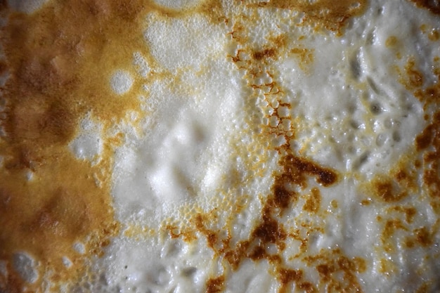 Texture of delicious fried pancake closeup full frame