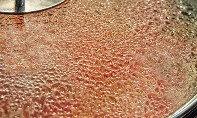 Texture of drops on glass cover with selective focus, background.