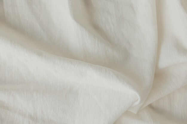 Photo texture of fabric cotton bag, creased material cloth fragment as a background