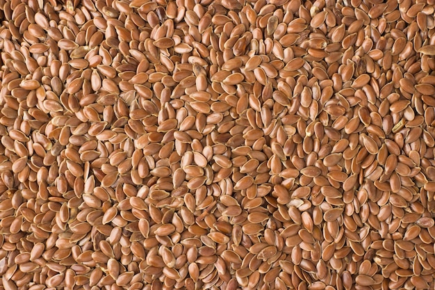 Texture of flax seeds close-up, spice or seasoning as background