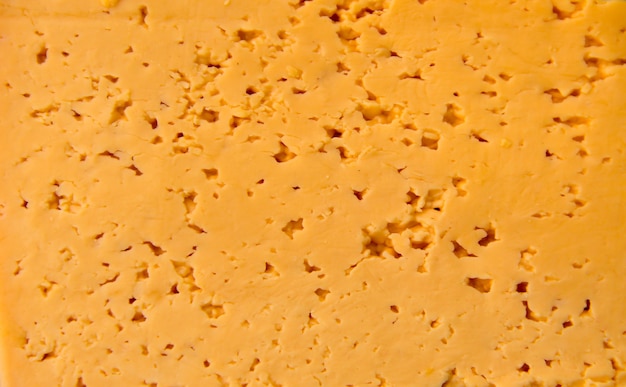 Photo texture of the fresh yellow cheese