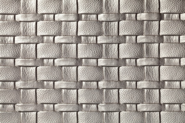 Texture of gray and silver leather background with wicker pattern, macro