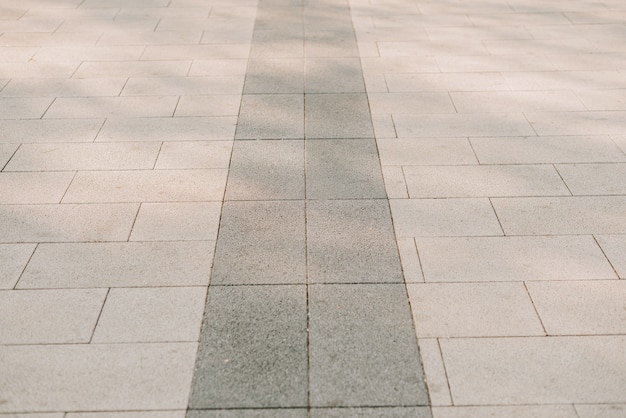 Texture of gray stone paving stones in close-up