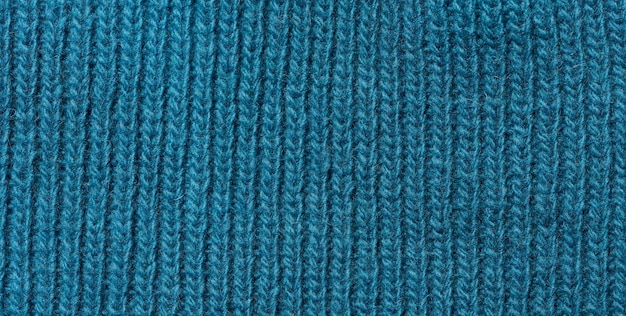 Texture of a knitted blue fabric Detail of clothing