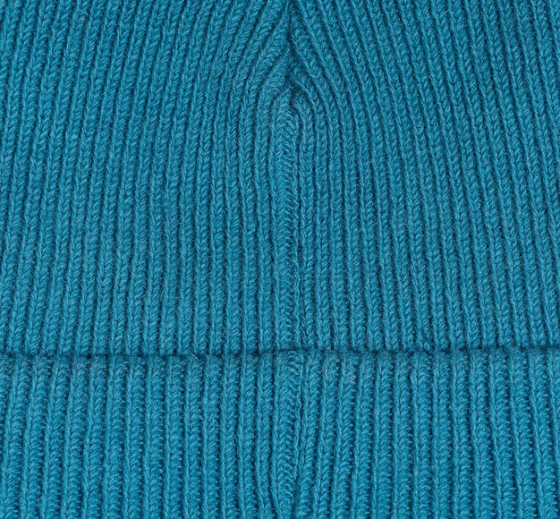 Texture of a knitted blue fabric Detail of clothing