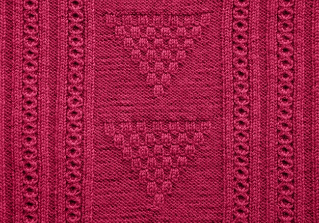 Texture of knitted sweater in viva magenta color of 2023 Viva Magenta