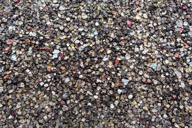 The texture of the landmark Berlin Wall is covered with chewing gum.