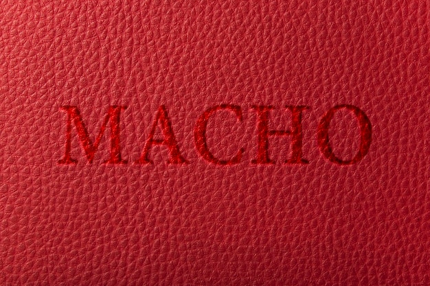 Texture of the leather red with embossed letters Macho