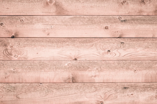 Texture of light wooden boards. Soft pink wood surface. Natural wallpaper pattern. White wood background. Rustic timber floor, vintage planks. Interior element.