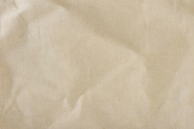 Texture of linen fabric in natural yellow color the surface of the linen fabric as a background or b