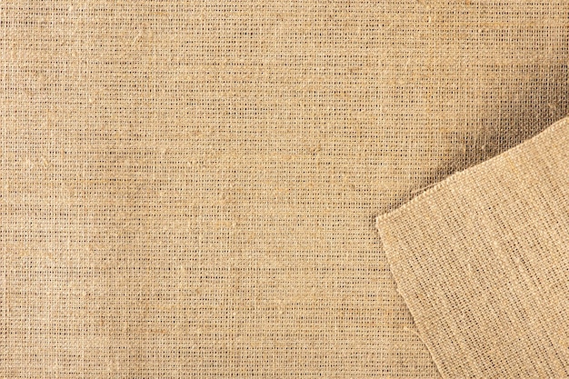 Texture of linen fabric in natural yellow color The surface of the linen fabric as a background or banner closeup