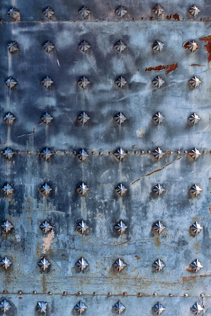 Texture of a metal canvas of an old forged door