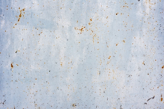 Texture of a metal wall with cracks and scratches which can be used as a background