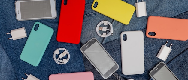 Texture of mobile phone accessories on a denim background