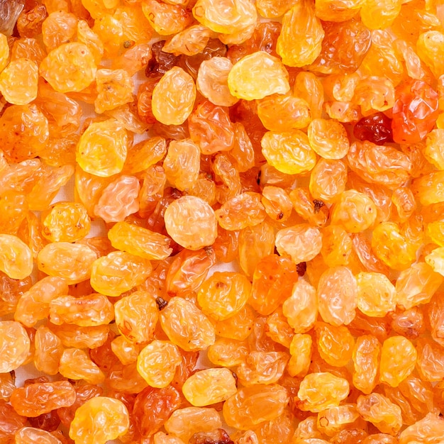 Texture of natural fresh yellow raisins