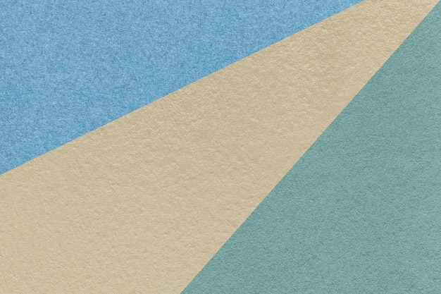 Texture of old craft beige blue and turquoise color paper background macro Vintage abstract cerulean cardboard