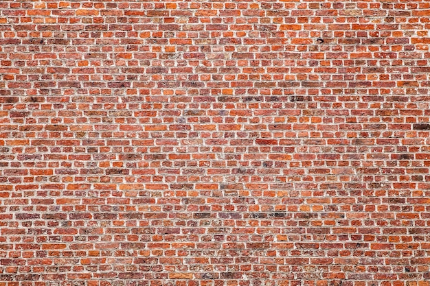 Photo texture of old dark brown blocks, red brick wall.