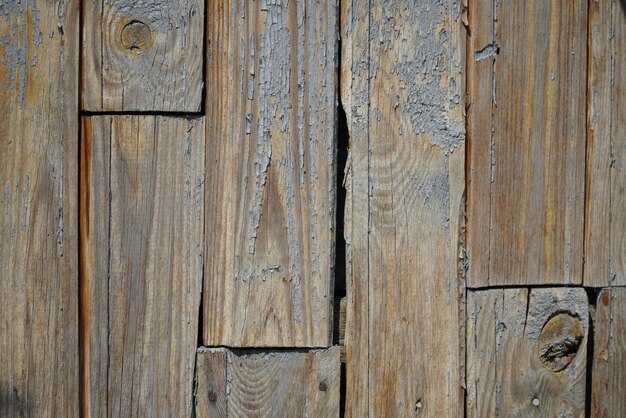 Texture of an old fence made of wooden boards closeup