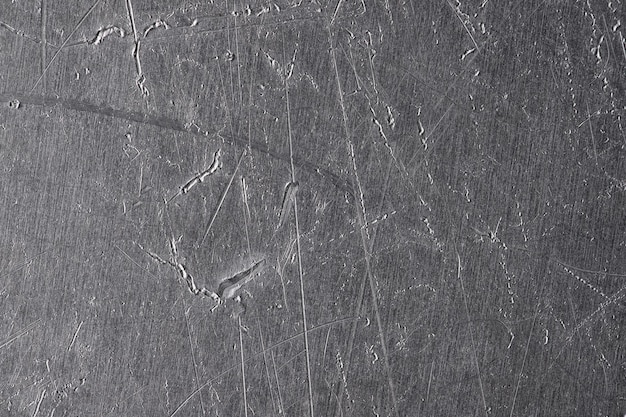 Texture of old metal with scratches and cracks silver plate metal background