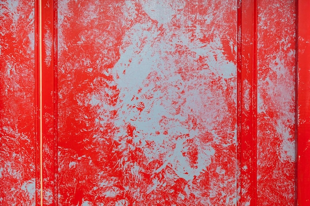 Texture of old painted wooden door of red and blue Background for design