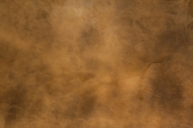 Texture of a orange brown concrete as a background, brown grungy wall