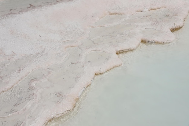 Texture of Pamukkale famous blue travertine pools and terraces