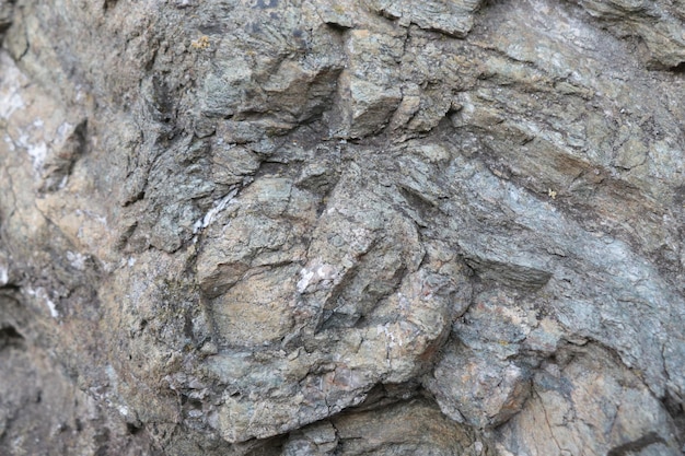 The texture of the rock closeup on the stone in the mountains