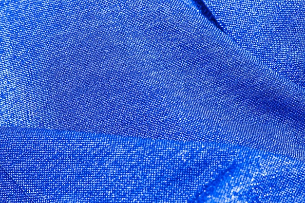 Texture of shiny sparkling lurex fabric blue color