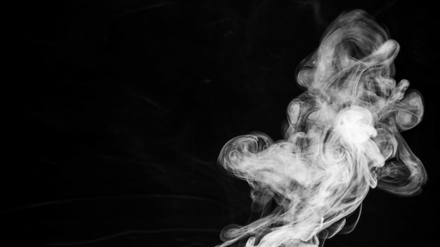 Photo texture of smoke on black background with copy space