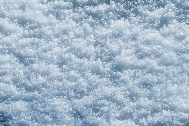 Texture of snow in sunny weather Snow cover with snow crystals