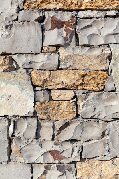 Texture of a stone wall Stone wall as a background or texture Part of a stone wall for background