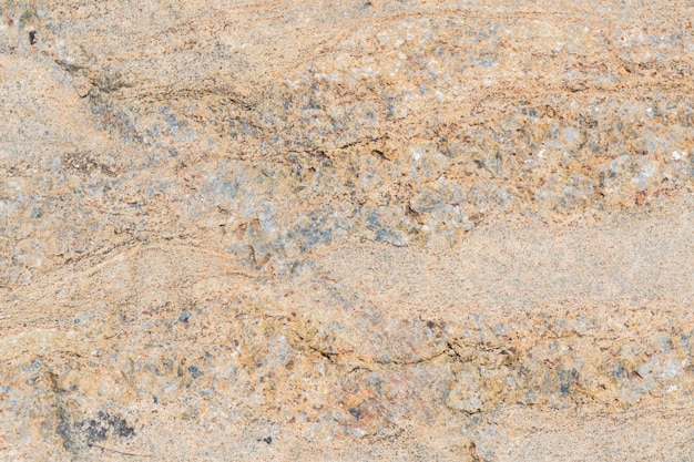 The texture of the stone with various impregnations.