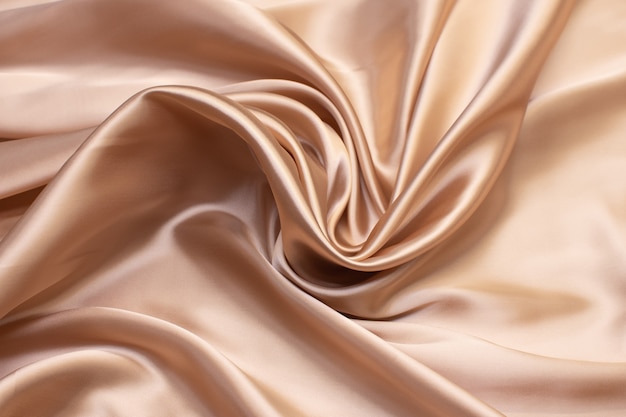 The texture of the synthetic fabric is light brown. 