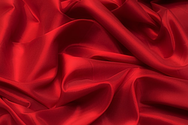 The texture of the synthetic fabric is red. Background, pattern.