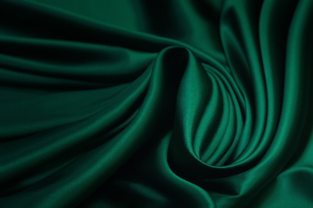 Texture,  Texture of green silk fabric. Beautiful emerald green soft silk fabric.