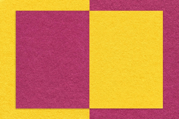 Texture of yellow and purple paper background with geometric shape and pattern macro Craft golden and lilac cardboard