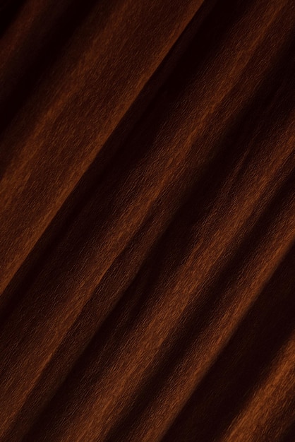 Textured background of brown crepe paper for crafts. Corrugated paper with a large background